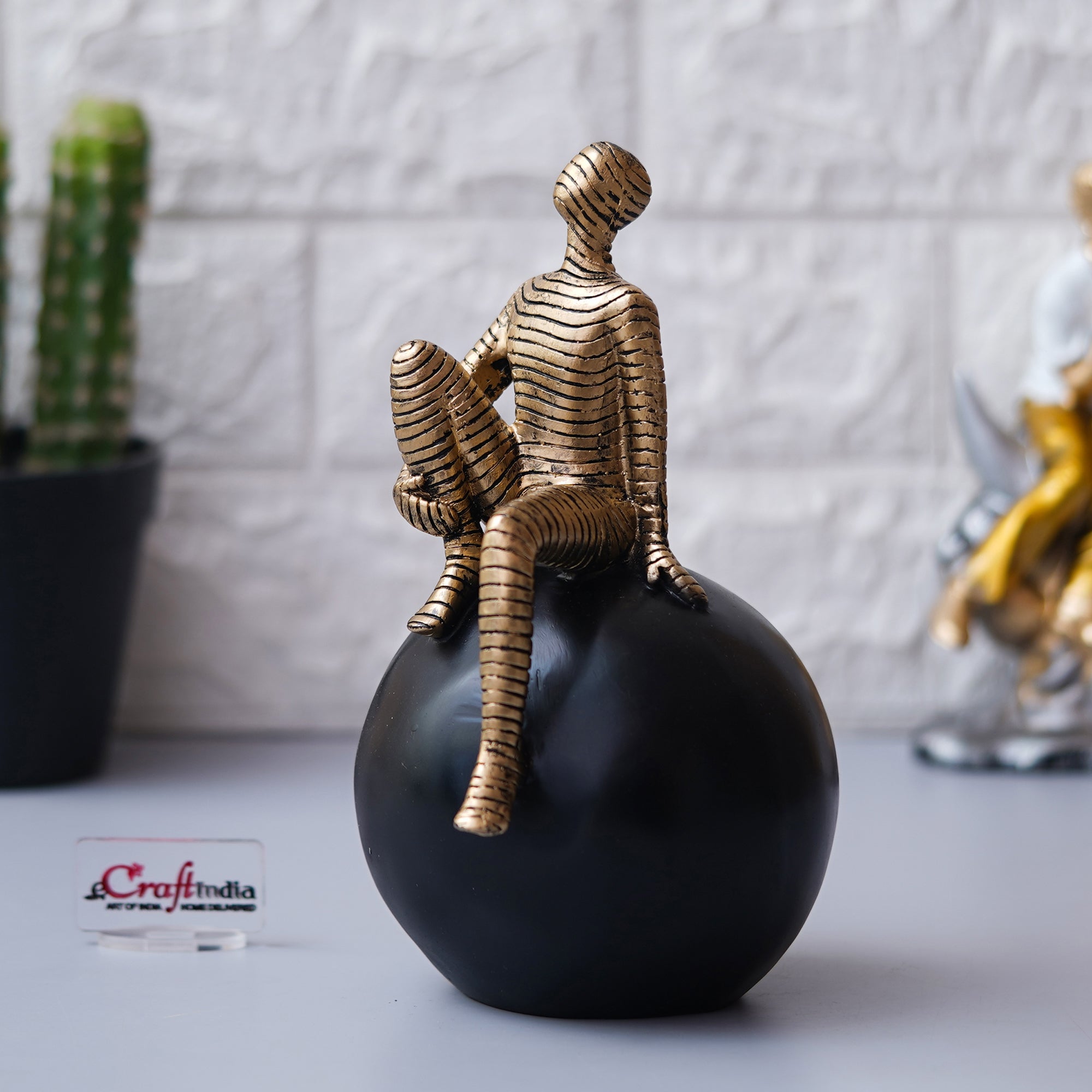 Golden Boy Statue Sitting on Black Ball Human Figurine Decorative Showpiece