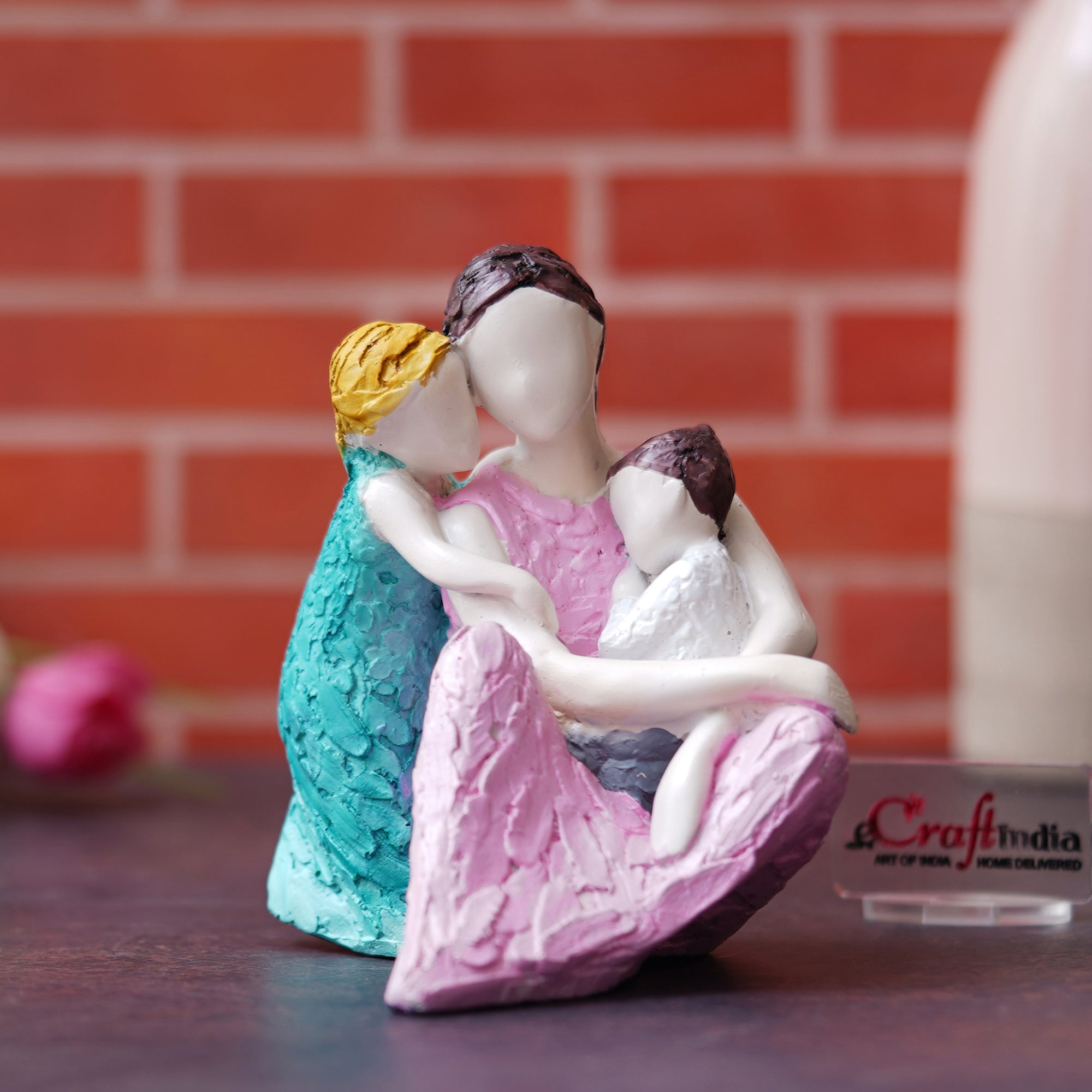 Happy Family of Mother, Daughter Backhugging, and Boy on Lap Human Figurine Decorative Showpiece