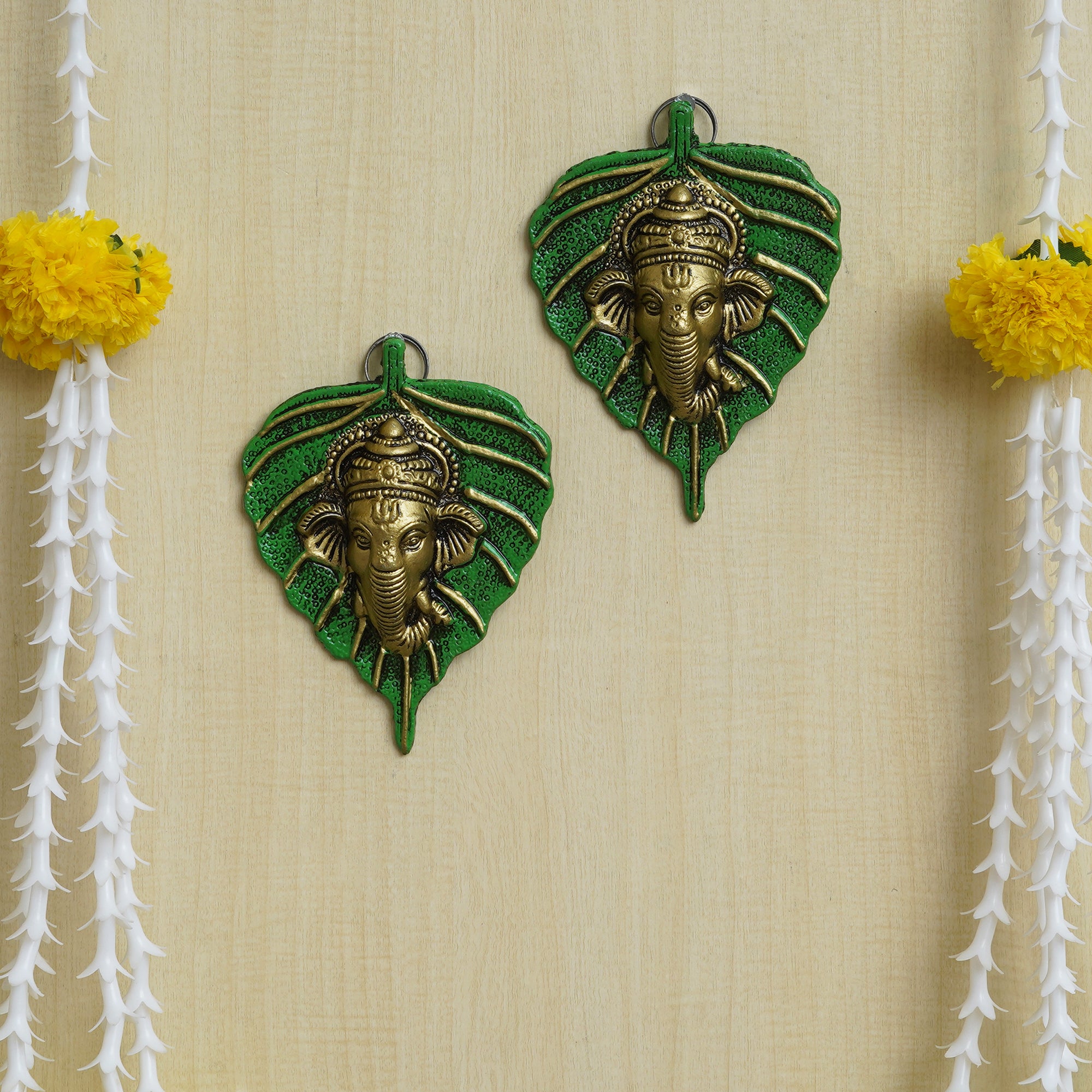 eCraftIndia Set of 2 Golden and Green Peepal Leaf Ganesha Wall Hangings 1