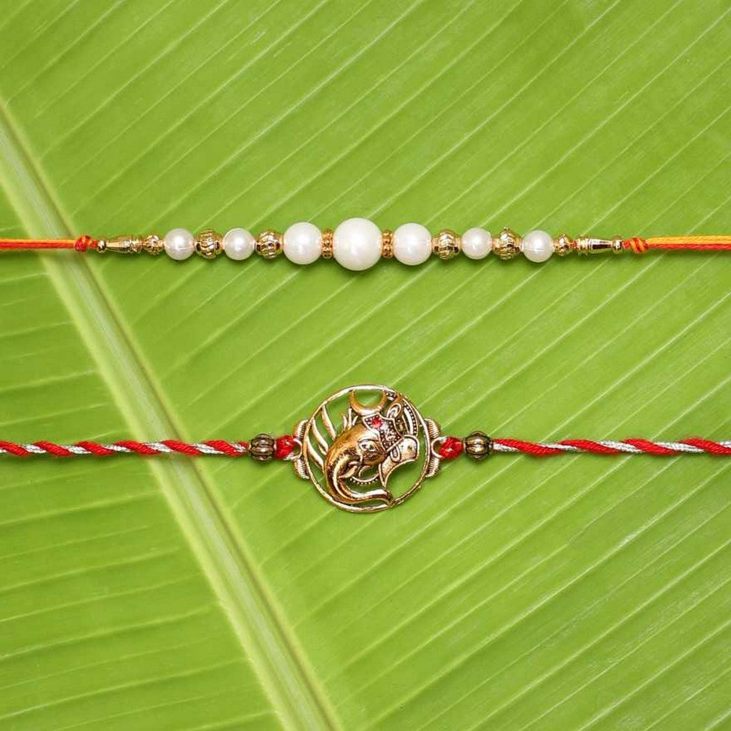 eCraftIndia Set of 2 Lord Ganesha and Beautiful Pearls Designer Rakhis with Roli Chawal Pack 2