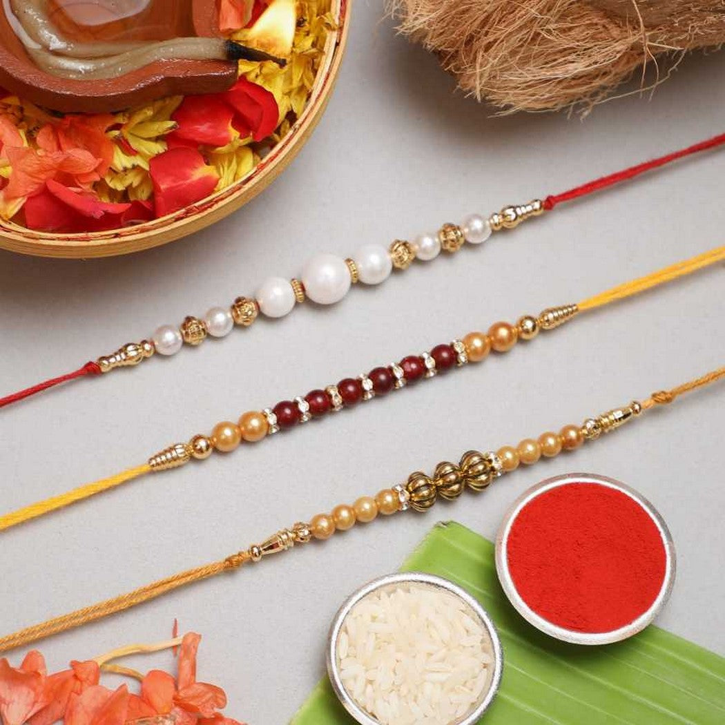 eCraftIndia White, Red & Golden Set of 3 Pearl Rakhis