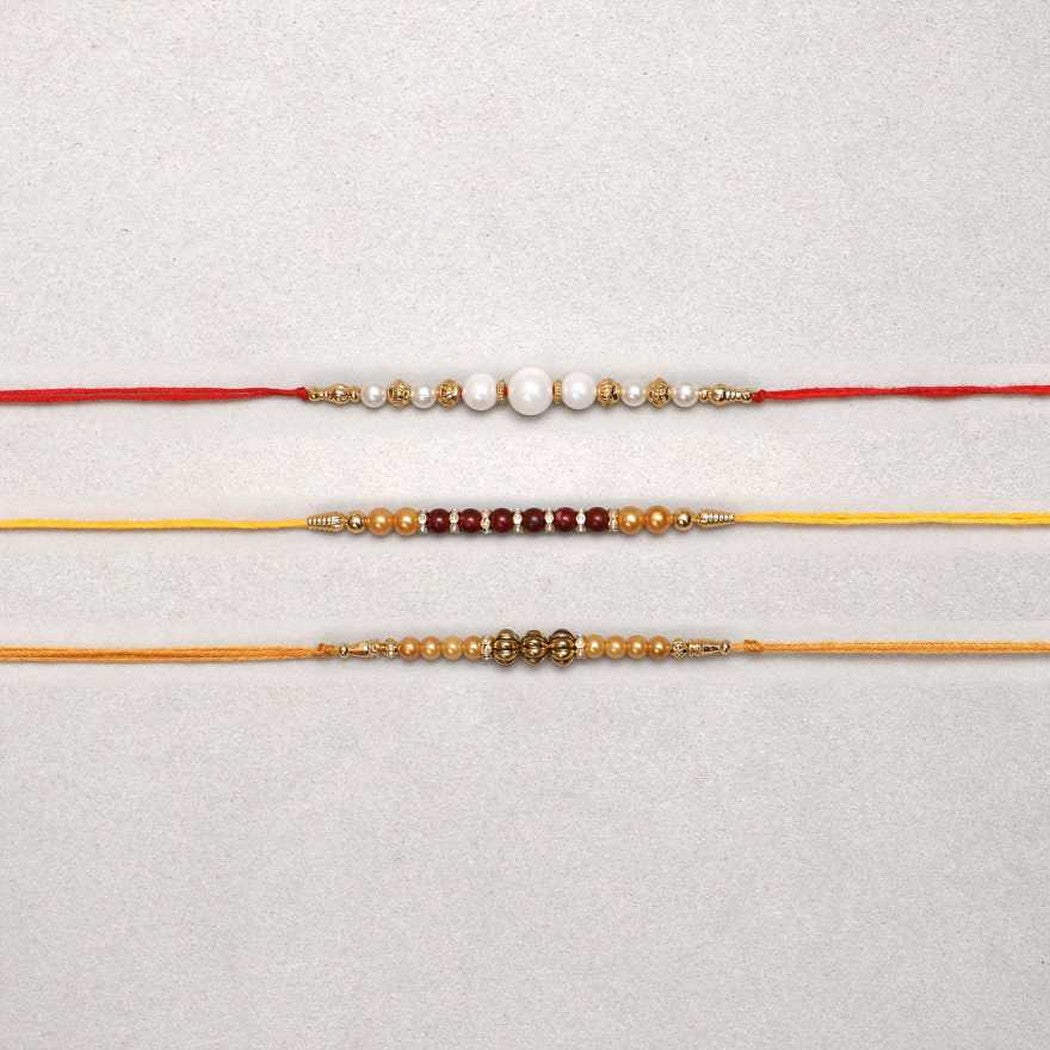 eCraftIndia White, Red & Golden Set of 3 Pearl Rakhis 2