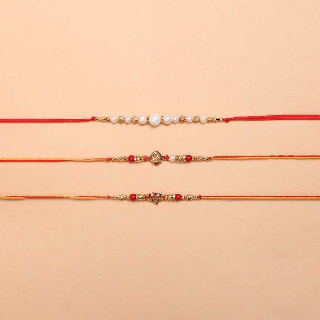 eCraftIndia Set of 3 Golden, Red & White Pearls, Om Symbol, Lord Ganesha Religious Designer Rakhis with Roli Chawal Pack 2