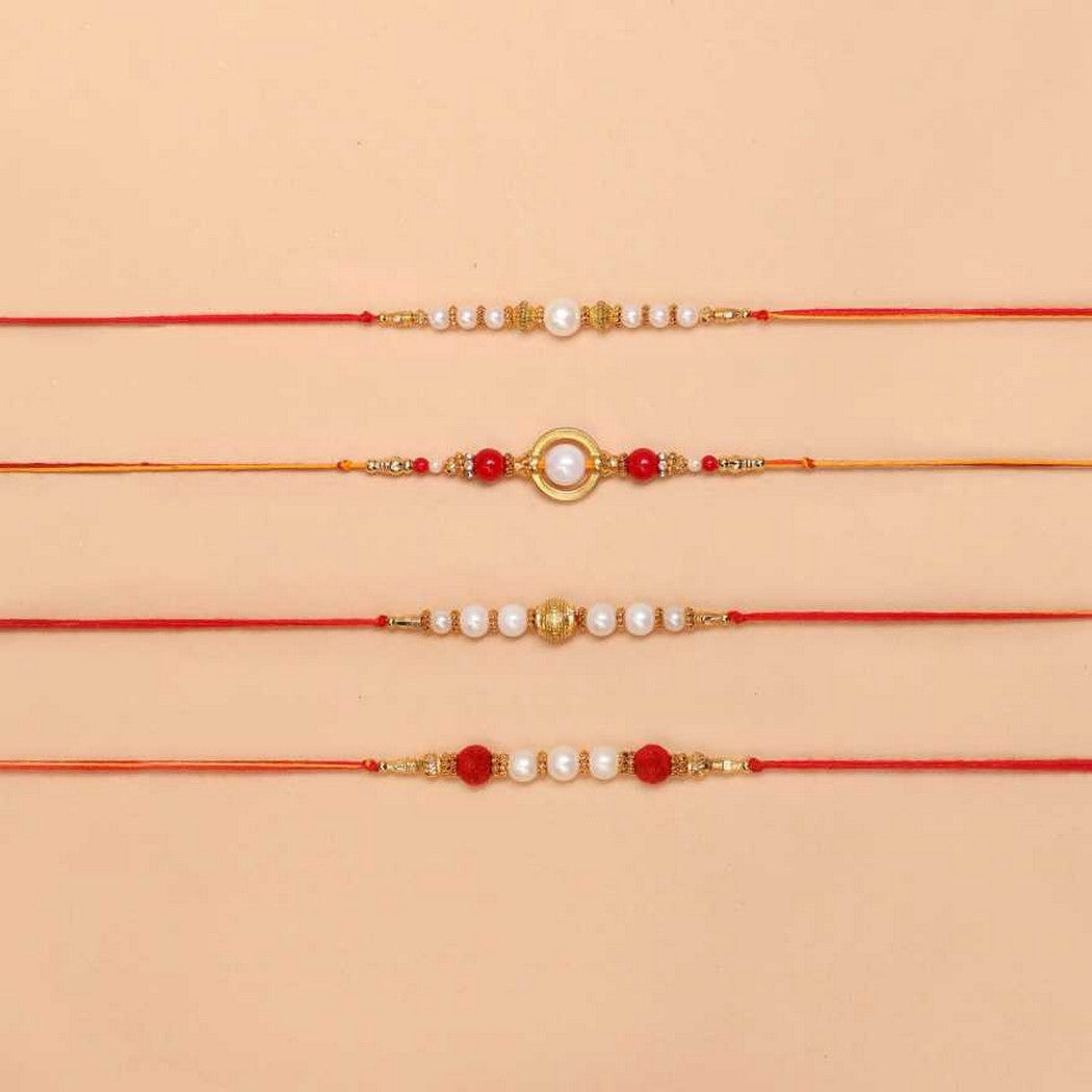 eCraftIndia Set of 4 Red, Golden White Pearls Rakhis with Roli Chawal Pack 1