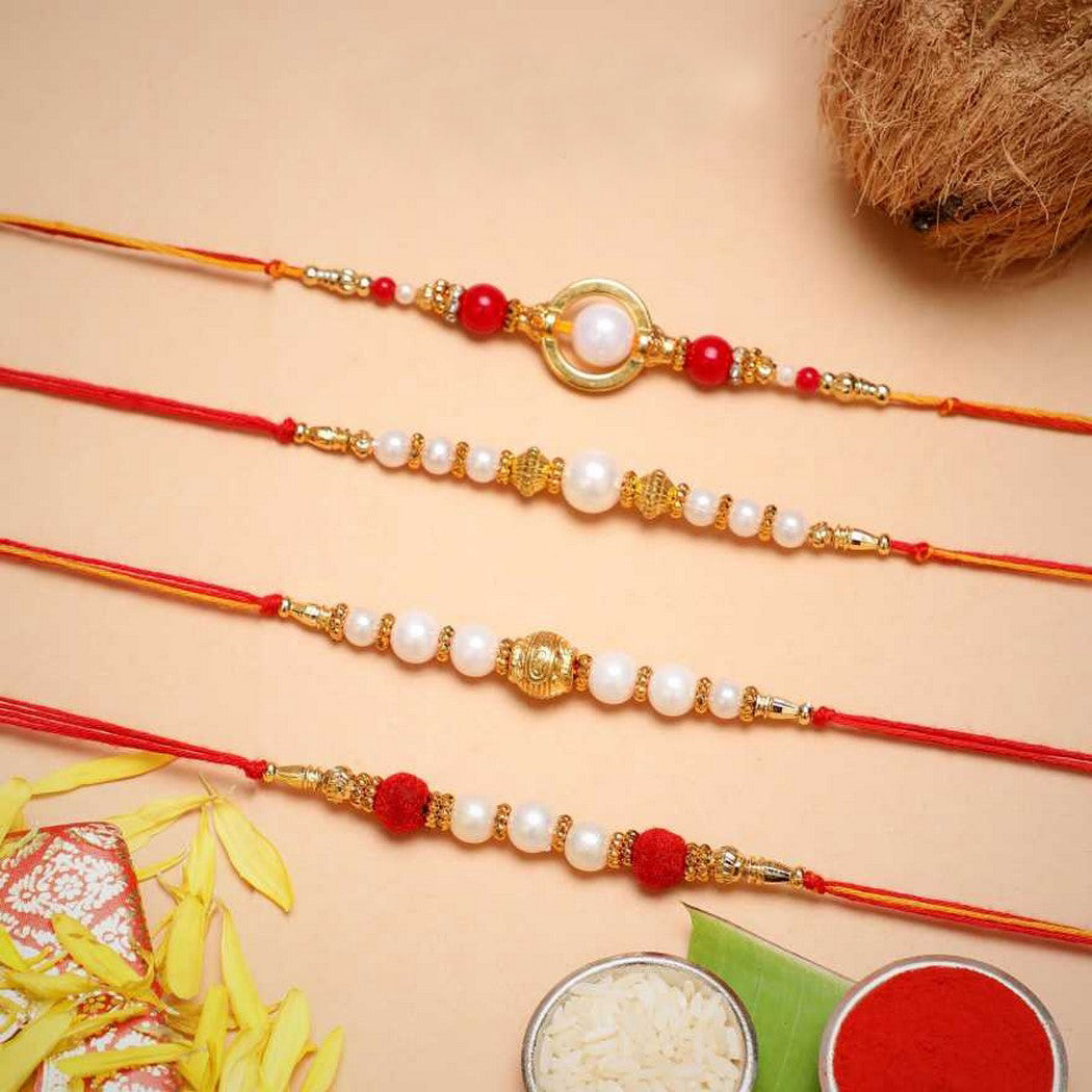 eCraftIndia Set of 4 Red, Golden White Pearls Rakhis with Roli Chawal Pack 2