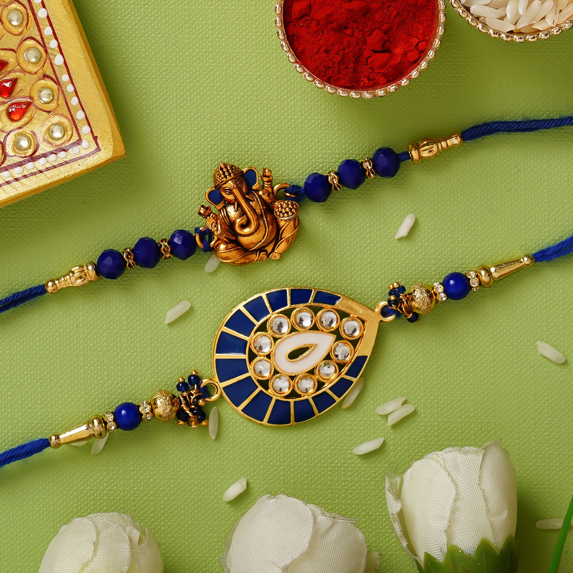 Blue Pack of 2 Designer Rakhis and Roli Chawal Pack