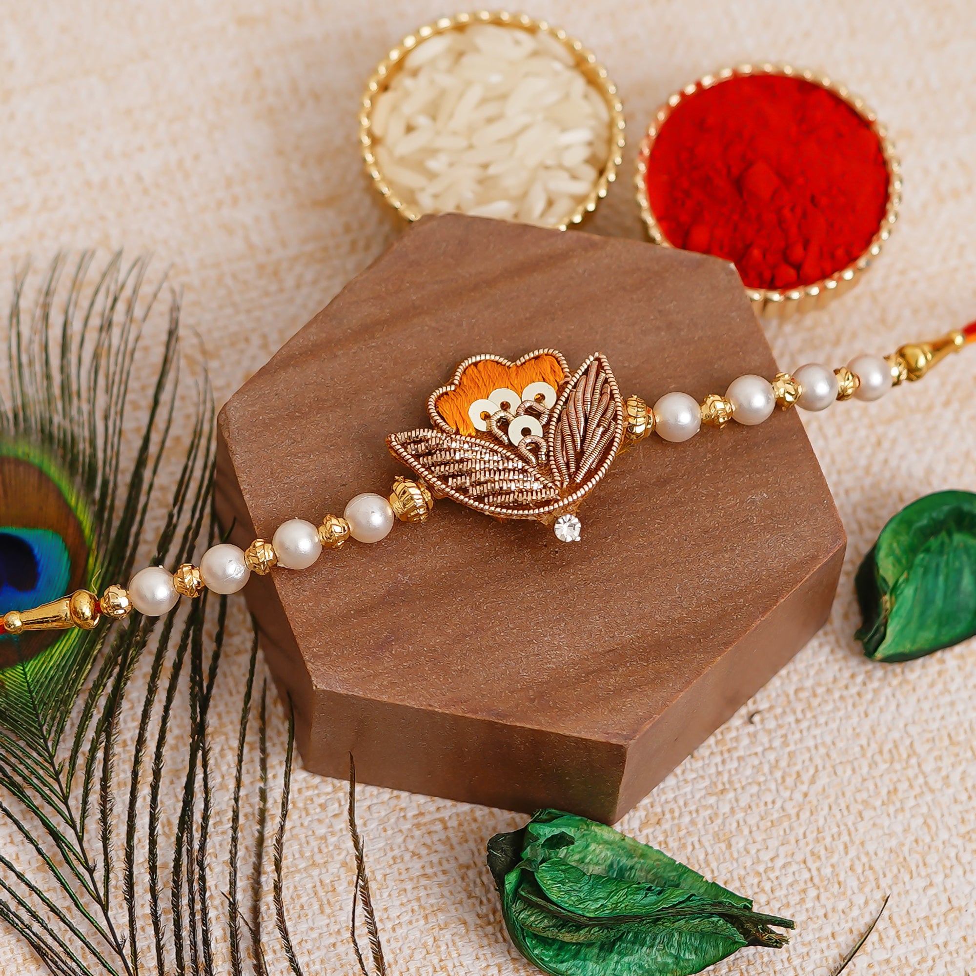 Orange Designer Pearl Leaf Rakhi  and Roli Chawal Pack