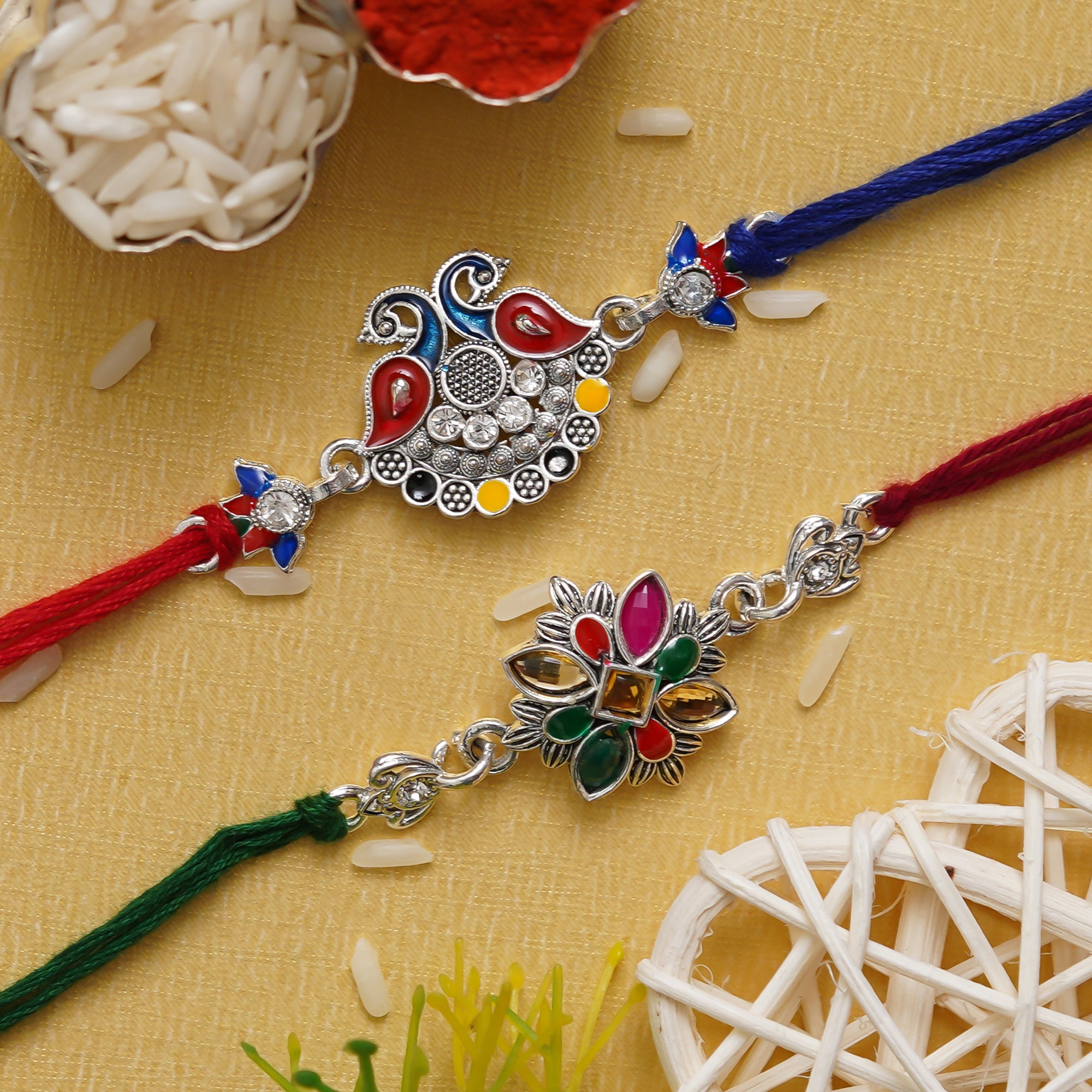 eCraftIndia Multicolor Set of 2 Peacock and Flower Designer Kundan Rakhis with Roli Chawal Pack