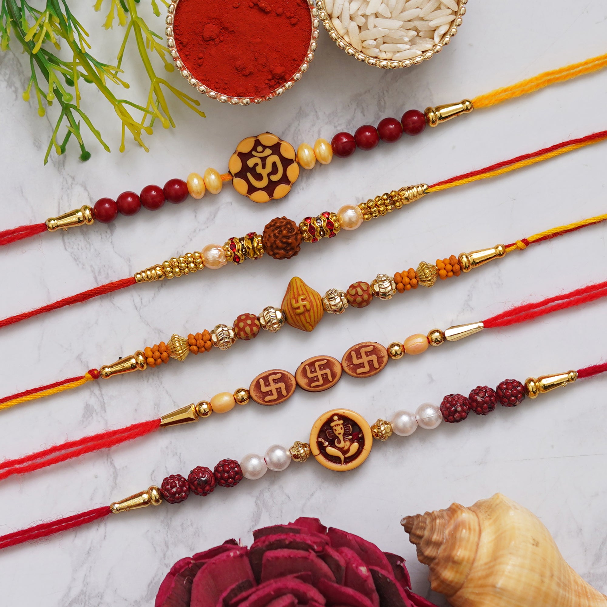 eCraftIndia Multicolor Set of 5 Om, Rudraksha, Swastik, Pearls, Ganesha Religious Designer Rakhis with Roli Chawal Pack