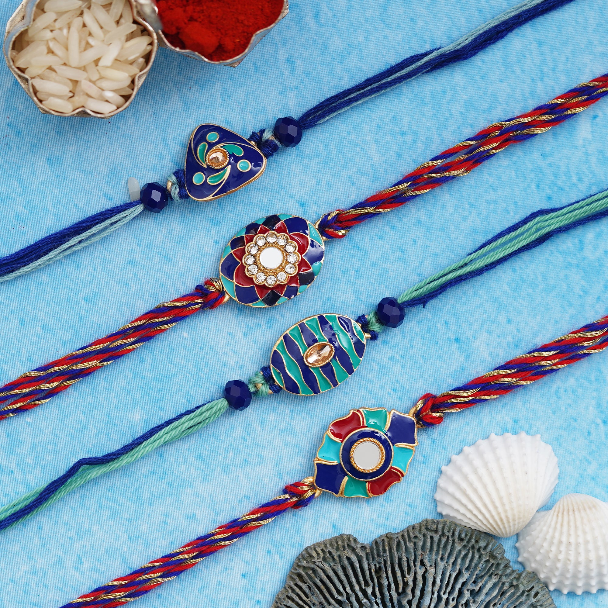 Set of 4 Blue, Red Floral Designer Rakhis with Roli Chawal Pack 1