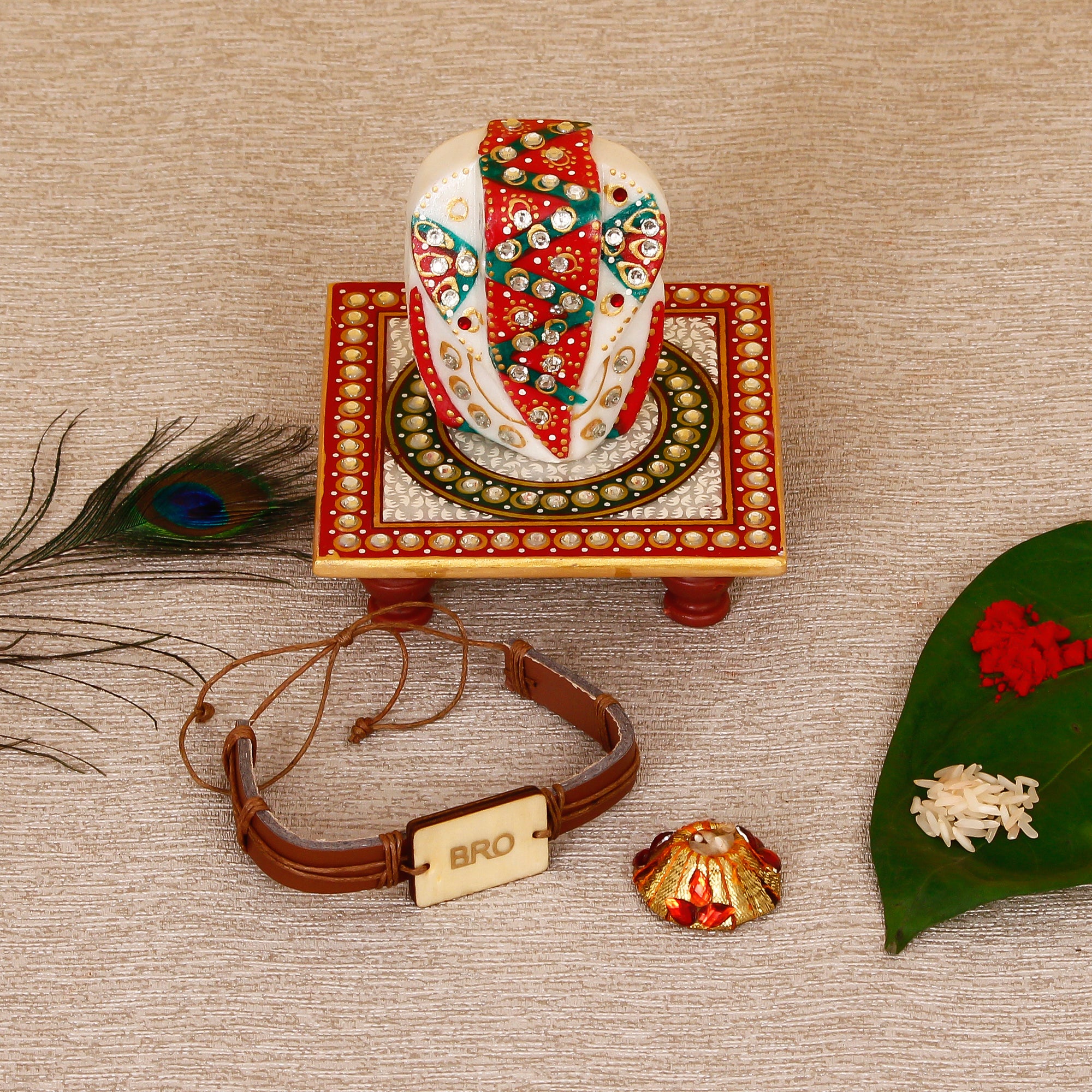 Designer Leather Bracelet BRO Rakhi with Lord Ganesha on Kundan Studded Marble Chowki and Roli Tikka Matki