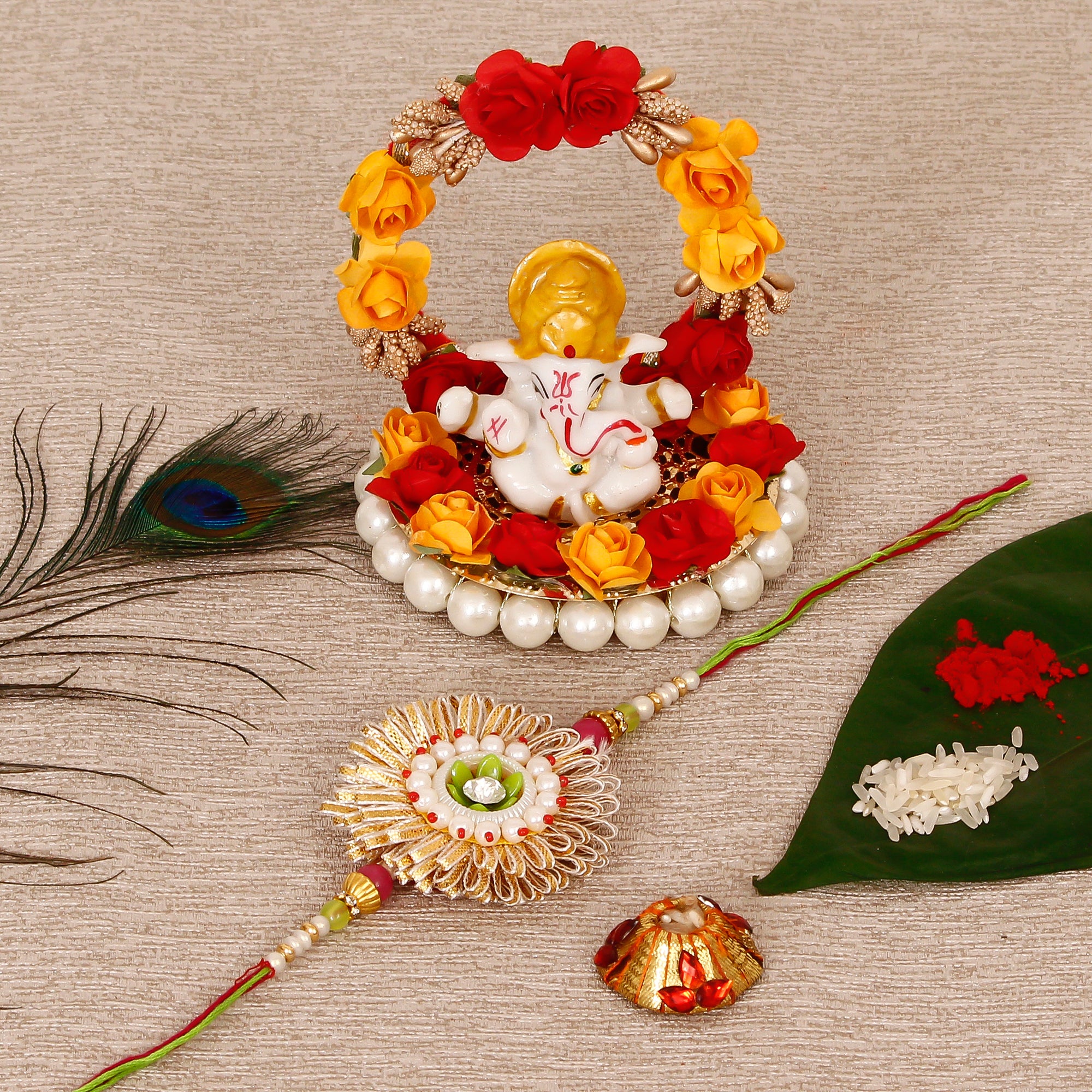 Designer Rakhi with Lord Ganesha Idol on Decorative Plate for Car & Home and Roli Tikka Matki