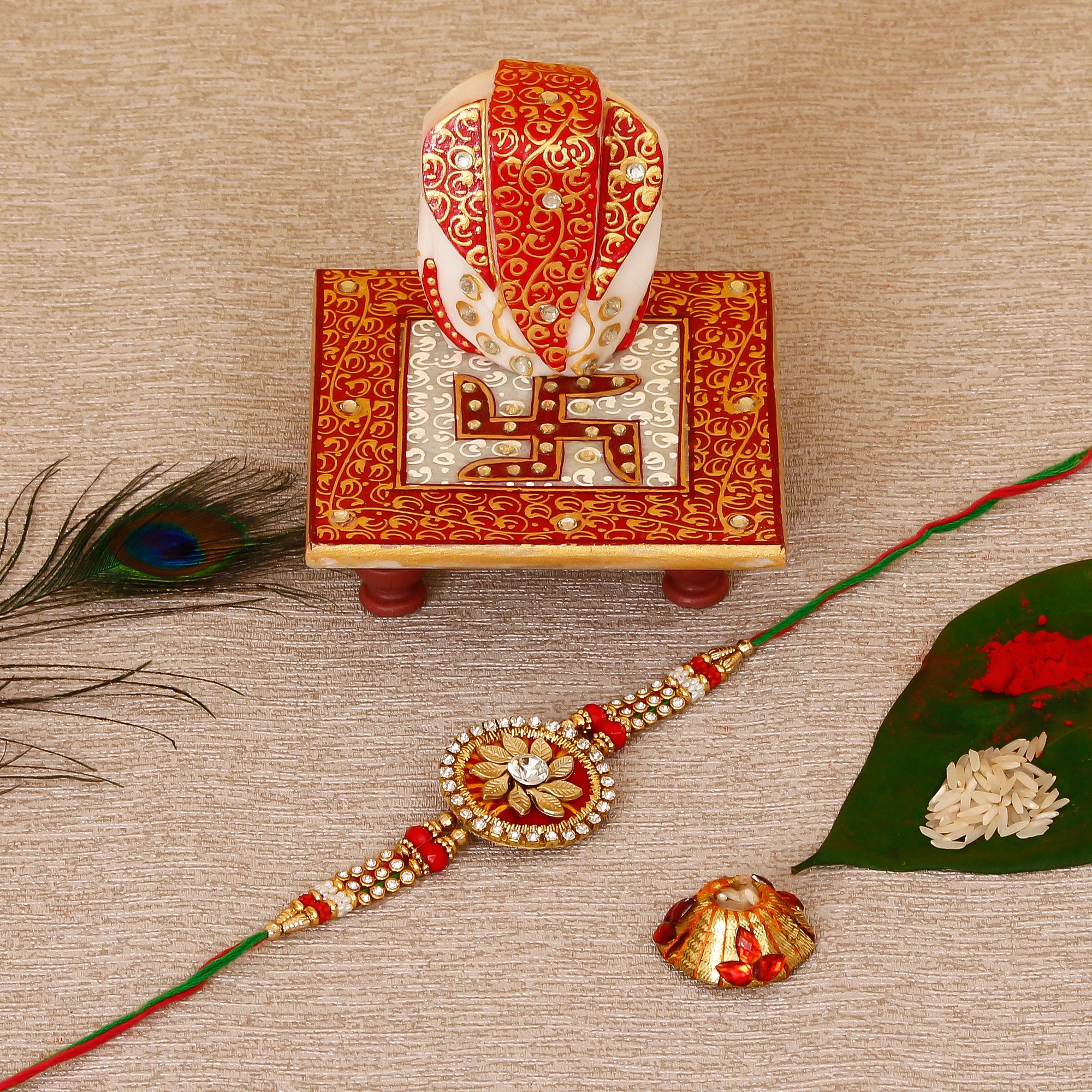 Designer Rakhi with Ridhi Sidhi Marble chowki and Roli Tikka Matki