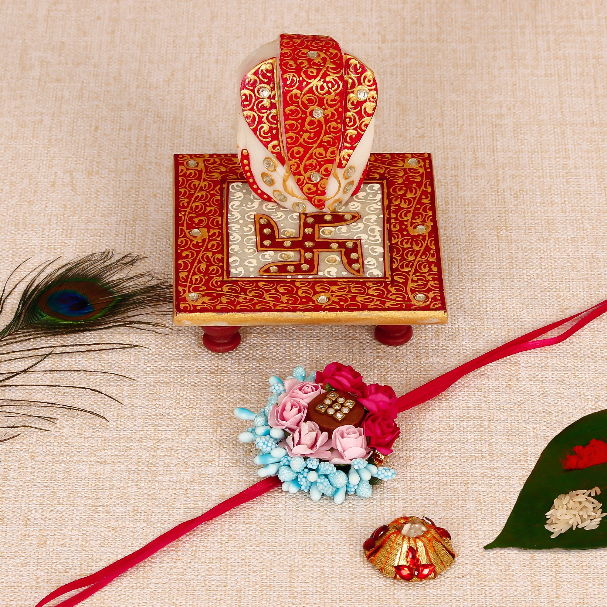 Designer Floral Rakhi with Ridhi Sidhi Marble chowki and Roli Tikka Matki