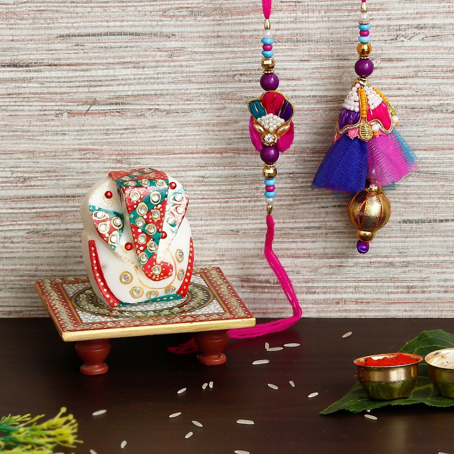 Designer Bhaiya Bhabhi Rakhi with Lord Ganesha on Kundan Studded Marble Chowki and Roli Chawal Pack