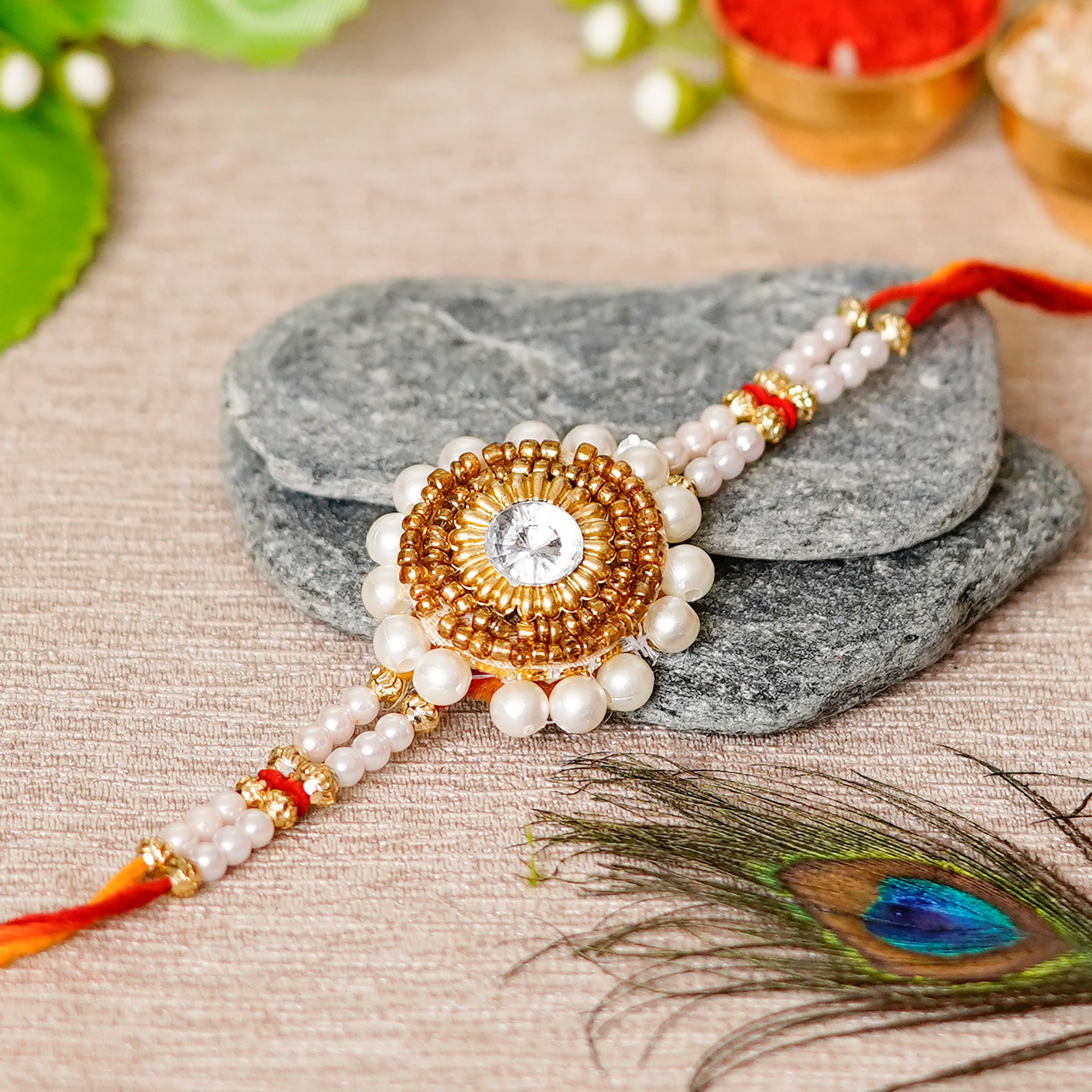 Desginer Stone and Pearl Rakhi with Lord Ganesha on Kundan Studded Marble Chowki and Roli Chawal Pack 1