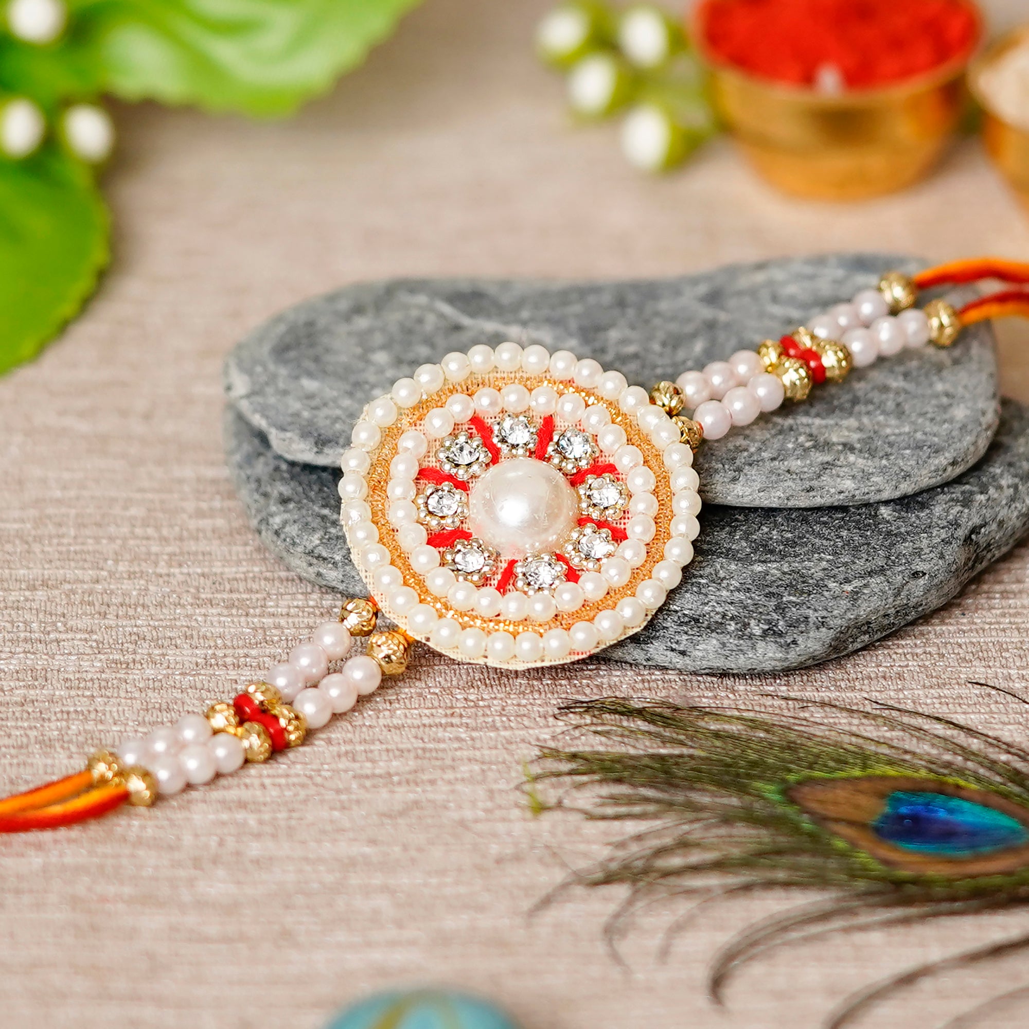 Desginer Stone and Pearl Rakhi with Lord Ganesha on Kundan Studded Marble Chowki and Roli Chawal Pack 1