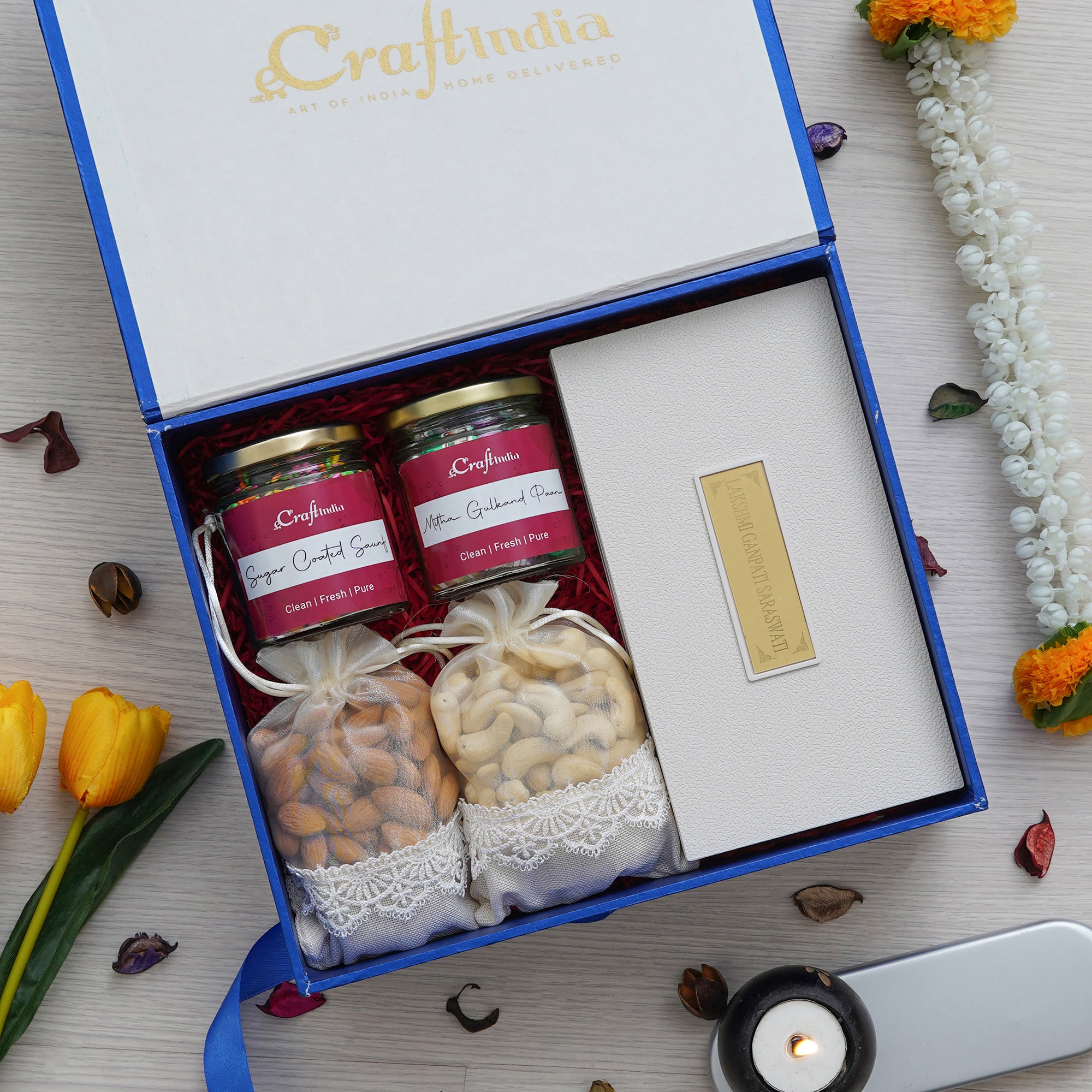 eCraftIndia Giftastic Box Hamper - 2 Potlis of Cashews, Almonds Dry Fruits (200gms Each), 2 Jars of Sugar Coated Saunf, and Meetha Gulkand Paan Mukhwas, Gold Plated Lakshmi Ganesha Saraswati Photo Frame, Charan Paduka, and Shubh Labh Pooja Box