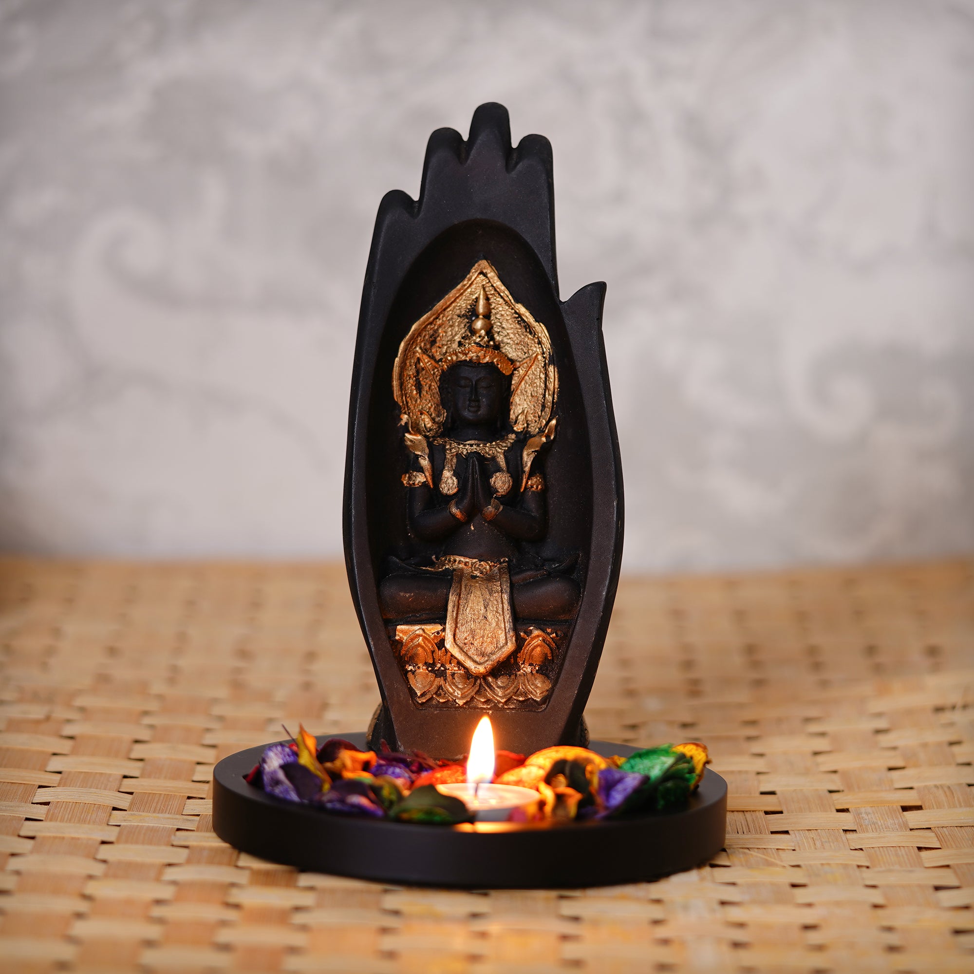 Meditating Buddha Idol Under Palm Decorative Showpiece With Wooden Base, Fragranced Petals, Tealight Holder