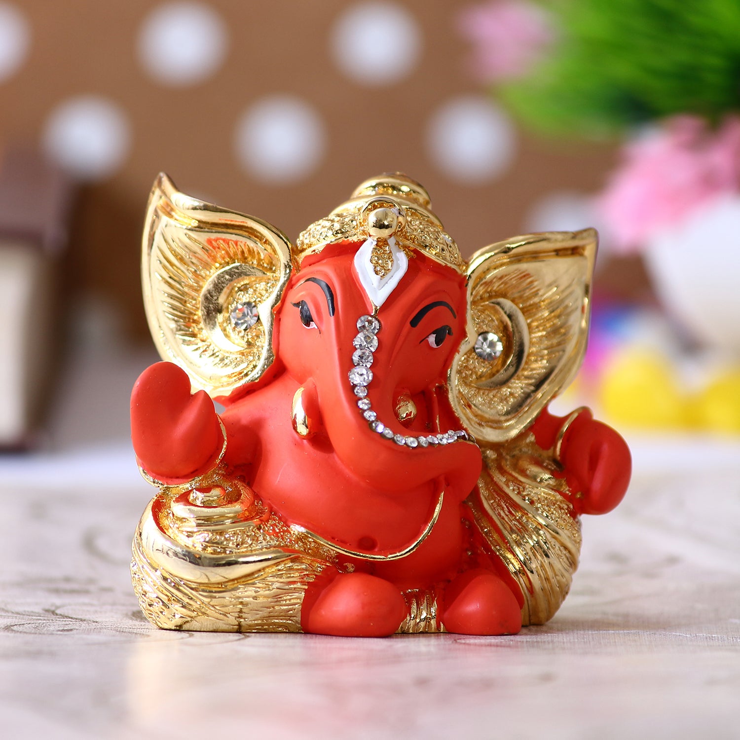 Gold Plated and Orange Polyresin Lord Ganesha Idol for Home, Temple, Office and Car Dashboard