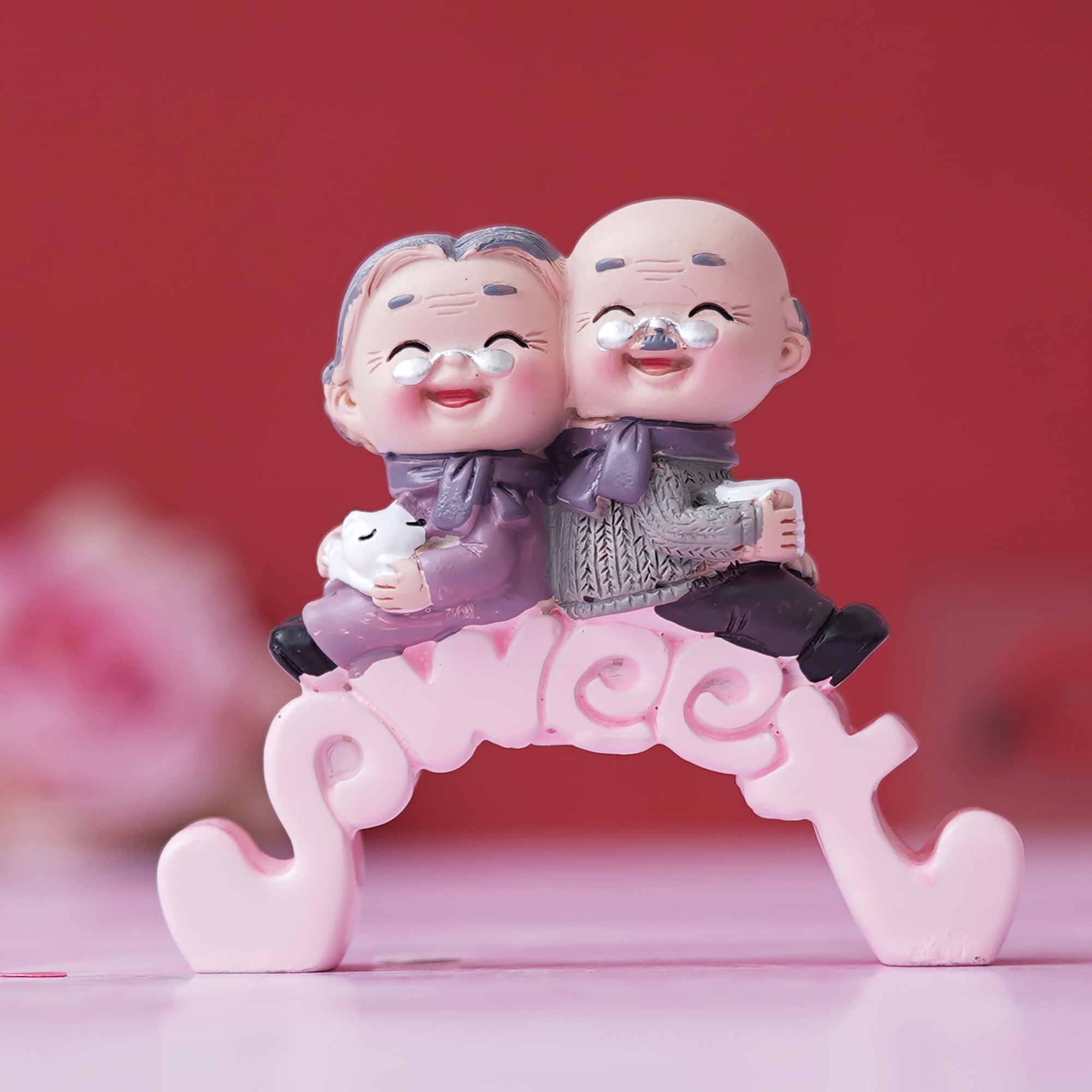 eCraftIndia Cute Old Couple Statue Sitting on Sweet Stand Decorative Showpiece