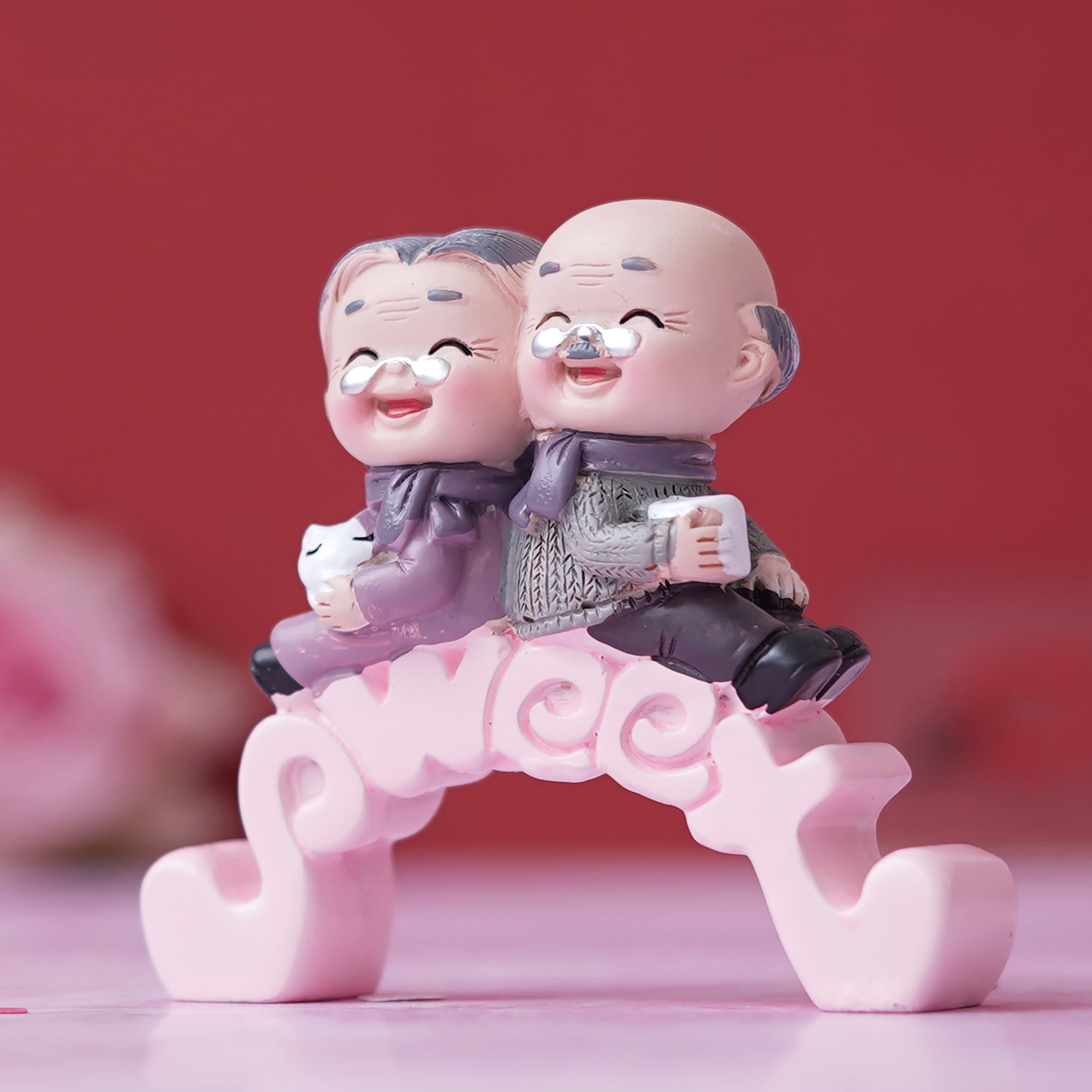 eCraftIndia Cute Old Couple Statue Sitting on Sweet Stand Decorative Showpiece 1